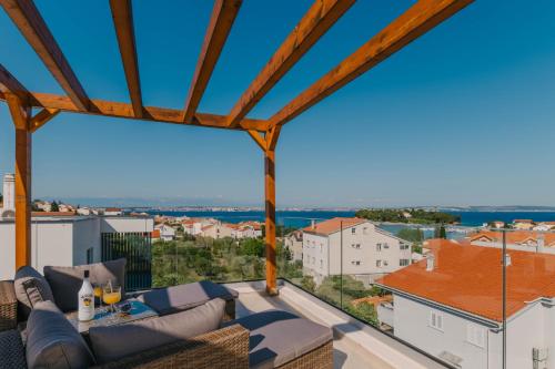 a view from the balcony of a house at A'More Preko in Preko