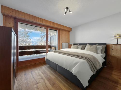 Postel nebo postele na pokoji v ubytování Ultimate Condo - 4 Valleys - Ski-in out - Swiss Alps