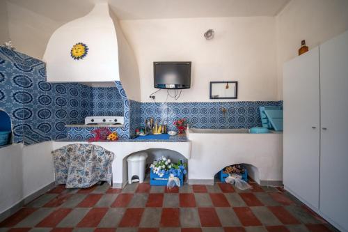 a living room with a doll house with a fireplace at The Twins rooms in Marettimo 1 in Marettimo