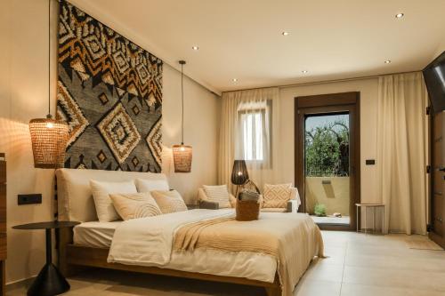a bedroom with a bed and a large wall at Boutique Hotel Caramel in Syvota