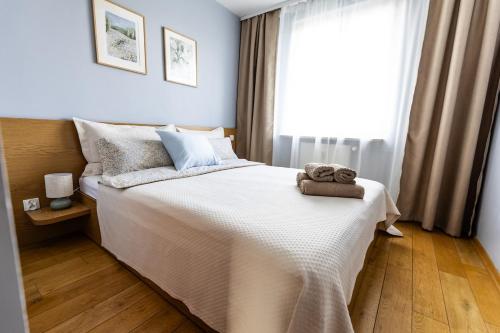Postel nebo postele na pokoji v ubytování Makówka na Krupówkach by Meadow Stay Apartments