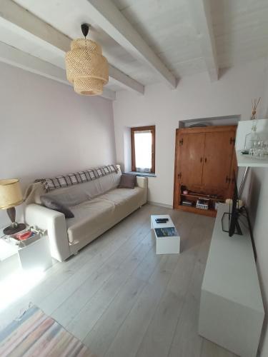 a living room with a couch and a table at Casa Pepita in San Bernardino Verbano