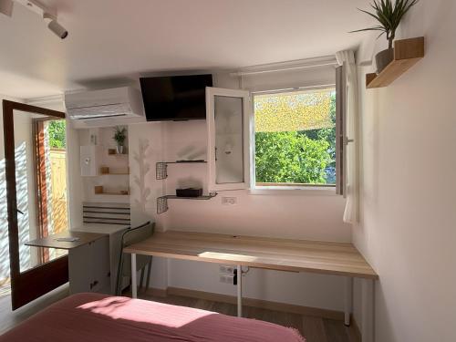 Ένα ή περισσότερα κρεβάτια σε δωμάτιο στο Studio terrasse