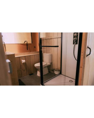 a small bathroom with a toilet and a sink at Camping Santa Elena in Lloret de Mar
