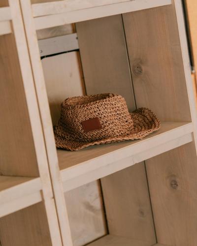 a brown purse sitting on a shelf at Camping Santa Elena in Lloret de Mar