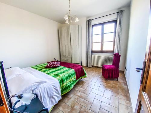A bed or beds in a room at Agriturismo Il Falco