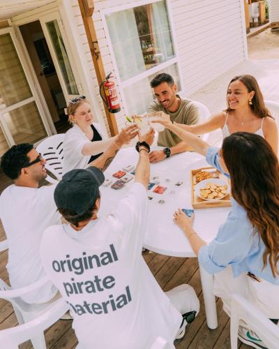 a group of people sitting around a table at Camping Santa Elena in Lloret de Mar
