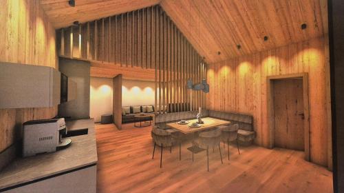 a rendering of a living room with a table and chairs at Rufana Alpin in Bürserberg