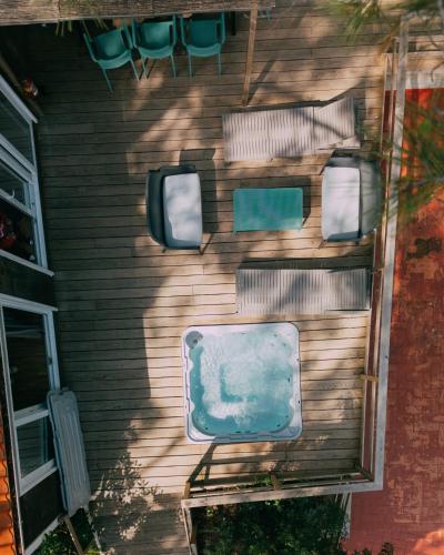 a house with three chairs on the side of it at Camping Santa Elena in Lloret de Mar