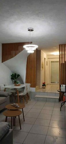 a living room with a couch and a table at Miminllari APARTMENTS 2 in Pefkohori
