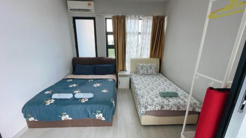 a bedroom with a bed and a bed and a chair at Mango House3-LuxurySweet I Biggest unit I infinity pool I Wifi-JQ in Kota Kinabalu