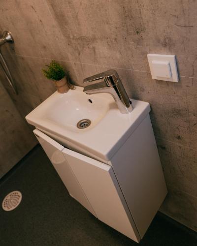 a bathroom sink with a faucet on top of it at Camping Santa Elena in Lloret de Mar