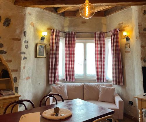 a living room with a couch and a table at Castel Madonna in San Martino di Castrozza
