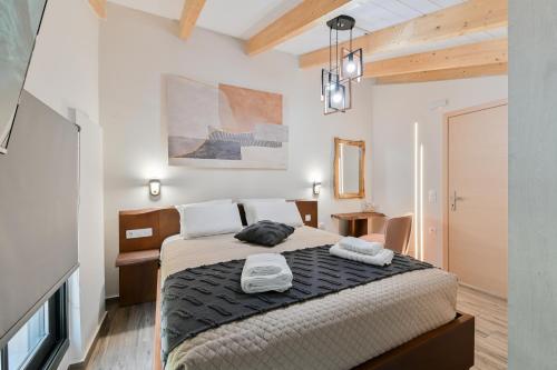 a bedroom with a large bed in a room at September15 Suites- Meganisi in Meganisi