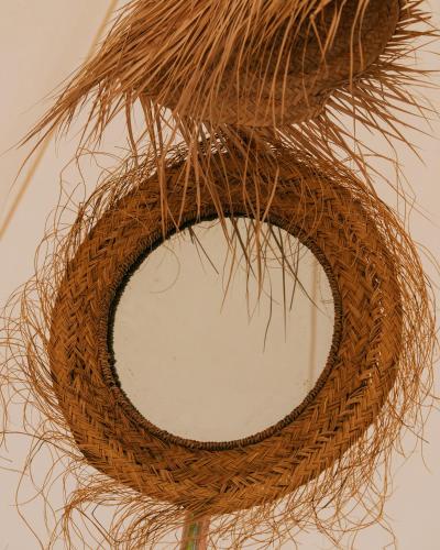 a wicker wreath hanging on a wall at Camping Santa Elena in Lloret de Mar