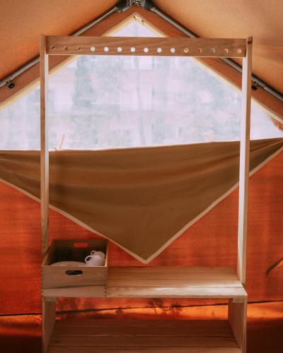 a hammock in a room with a window at Camping Santa Elena in Lloret de Mar