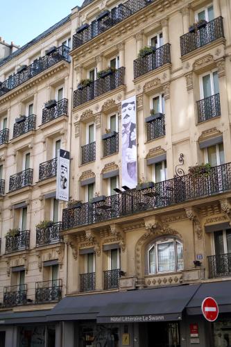 a building with balconies on the side of it at Hotel Litteraire Le Swann, BW Premier Collection in Paris