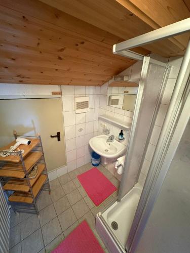 an overhead view of a bathroom with a sink and a tub at Ferienhof Kohler in Fügen