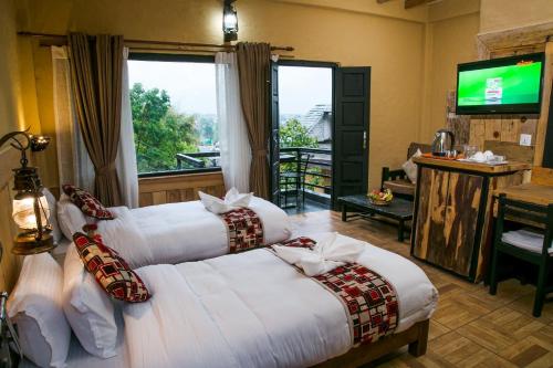 Postel nebo postele na pokoji v ubytování Hotel Tourist Residency