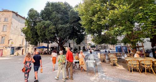 a group of people walking down a street at Hypercentre - Proche Place St Didier in Avignon