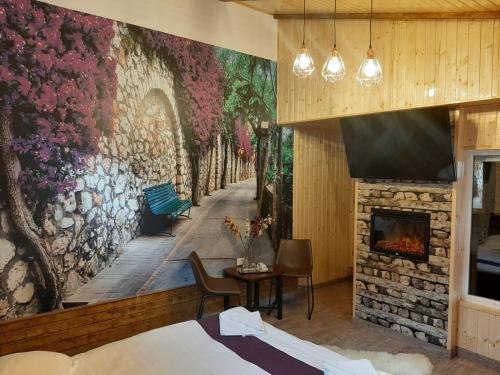 a bedroom with a wall mural of a street at La Cristina in Sinaia