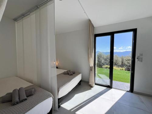 Katil atau katil-katil dalam bilik di Bas de villa aux portes d'Ajaccio