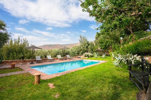 a swimming pool in the yard of a house at Atlas Smile Retreat in Ouirgane
