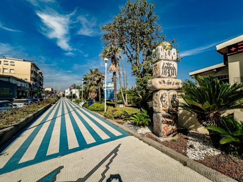 an empty street with a crosswalk in a city at Caruggi Lifestyle - mare 200m - AC - WiFi in Albissola Marina