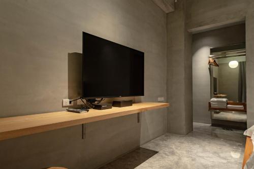 a television on a shelf in a room at 全村的希望Hope of village in Dongshan