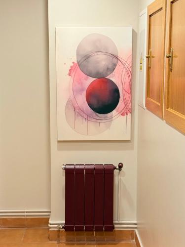 a painting hanging on a wall in a room at Hotel Bouza in Ribadeo