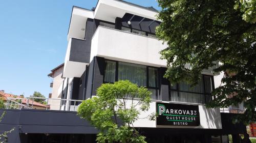 a building with a sign for a guest house at гест хаус паркова 33 in Razgrad