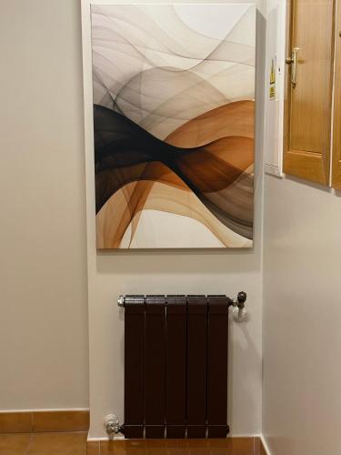a painting hanging on a wall in a bathroom at Hotel Bouza in Ribadeo