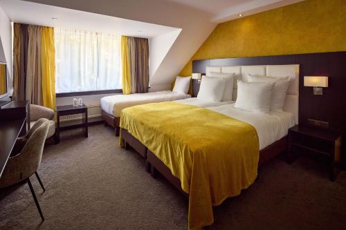 Katil atau katil-katil dalam bilik di Hotel Moers van der Valk
