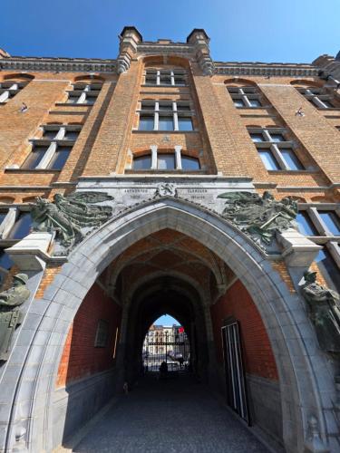an entrance to a brick building with an archway at JAM Ghent in Ghent