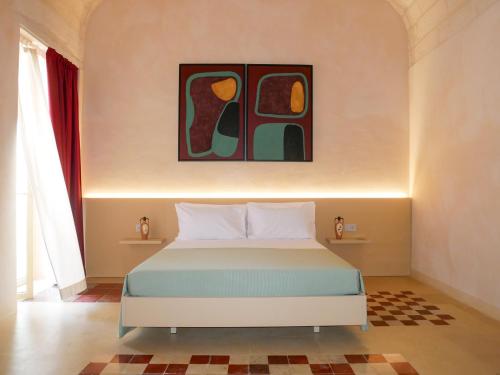 Кровать или кровати в номере PALAZZO VIGILARIUM - Boutique Rooms - Rooftop & Arts Hotel