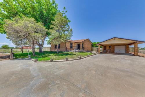 an empty parking lot in front of a house at 4 Mi to Museums Roswell Getaway with Game Room! in Roswell