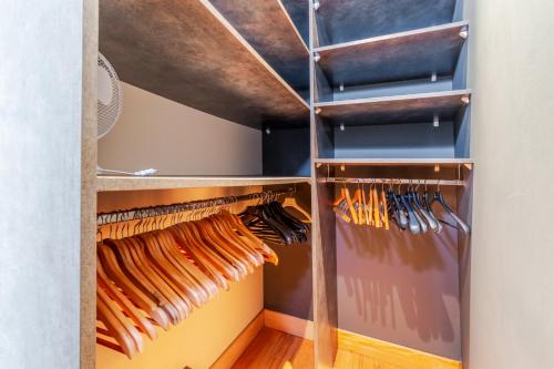 a walk in closet filled with lots of wooden utensils at Le Port Neuf - Appartement en coeur de ville historique in Bayonne