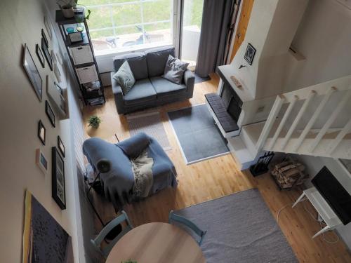 an overhead view of a living room with a couch at Cosy loft apartment w sauna & Pyhätunturi view in Pyhätunturi