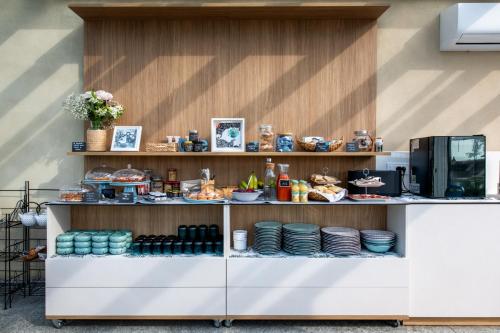 a counter with plates and food on it at Villa Sarmassa in Narzole