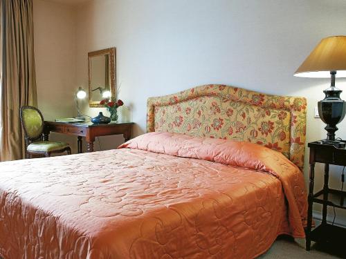 Ένα ή περισσότερα κρεβάτια σε δωμάτιο στο Grecotel Larissa Imperial