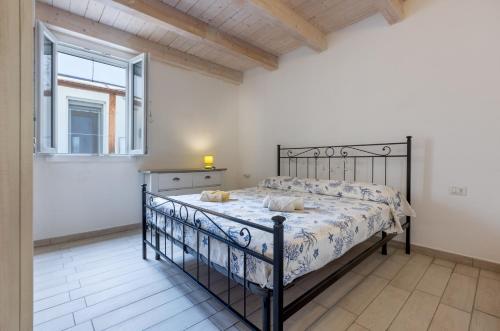 En eller flere senge i et værelse på GuestHost - La Ca' Rosa