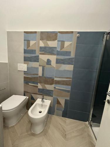 a bathroom with a toilet and a bidet at Little Home 25 in Scafati