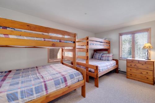 a bedroom with two bunk beds and a desk at Tyra Stream 234 by Ski Country Resorts in Breckenridge