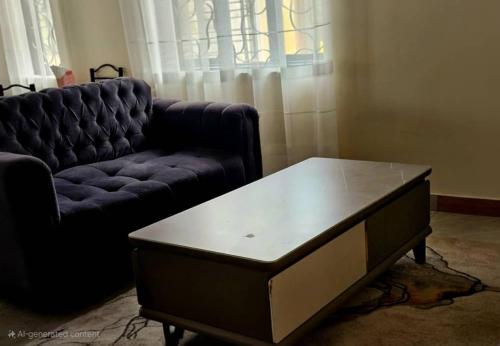 a living room with a couch and a coffee table at Spea Residency Apartment in Mbarara