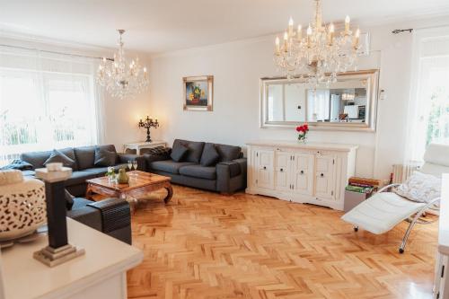 a living room with a couch and a table at Kuća za odmor Dugo Selo M&A in Dugo Selo