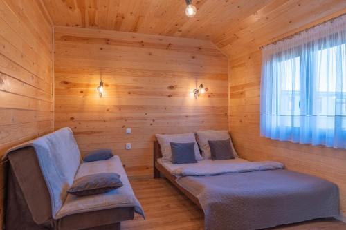 Postel nebo postele na pokoji v ubytování Chatki u Patki