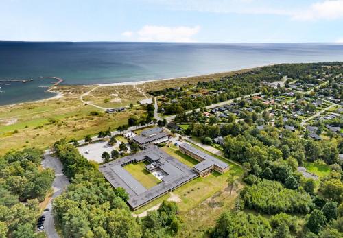 an aerial view of a large building next to the water at Hotel Marina in Grenå