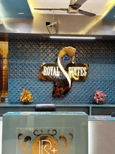 a wall with a sign for a roka spices store at Hotel Royal Suites In Ajmer in Ajmer