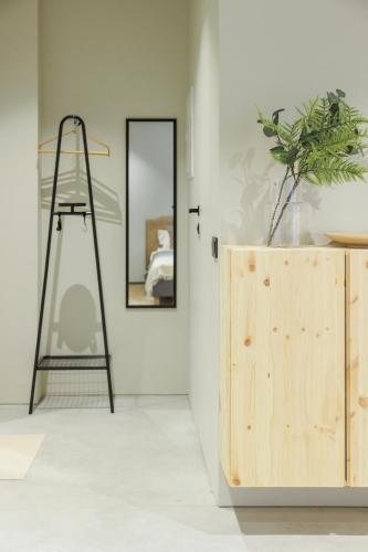 a ladder and a mirror in a room at citywave Vilnius in Vilnius