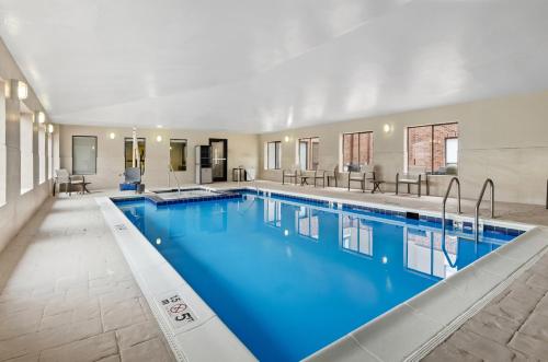 a large pool with blue water in a building at Holiday Inn Express Princeton/I-77 by IHG in Princeton